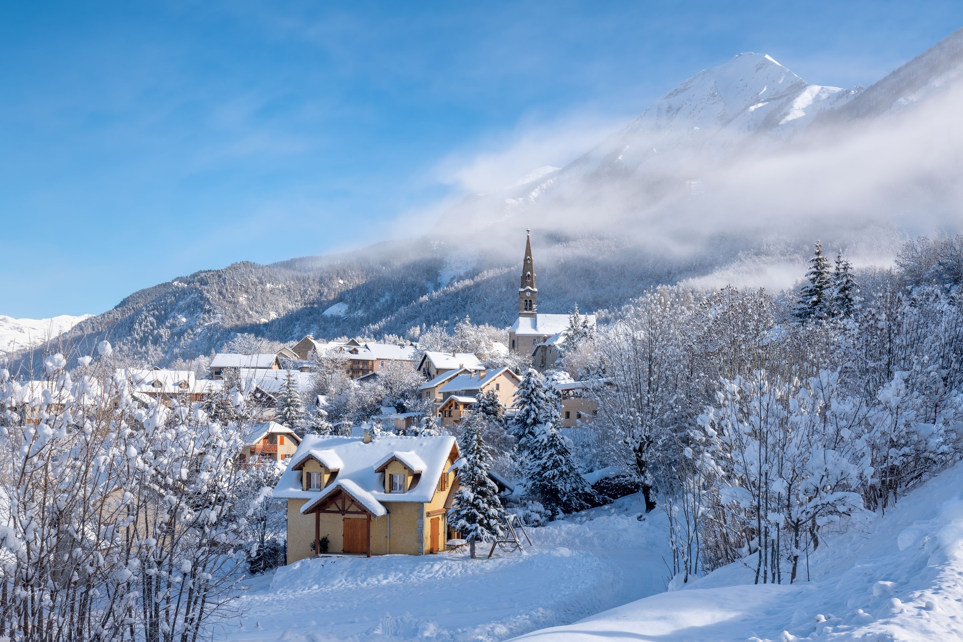 The village of Saint Leger les Melezes in Hautes-Alpes covered in snow in winter. Ski resort in the Ecrins National Park (French Alps). France